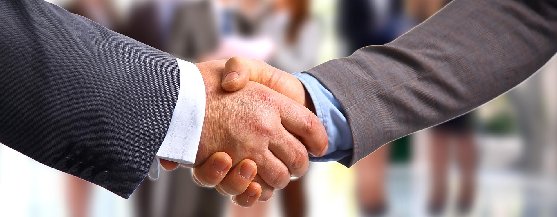 Kropschot header image of hand shake