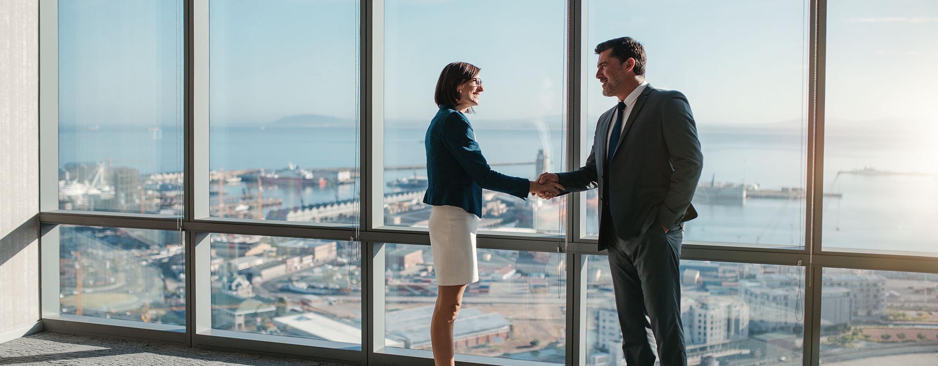 Kropschot header image of high rise window meeting